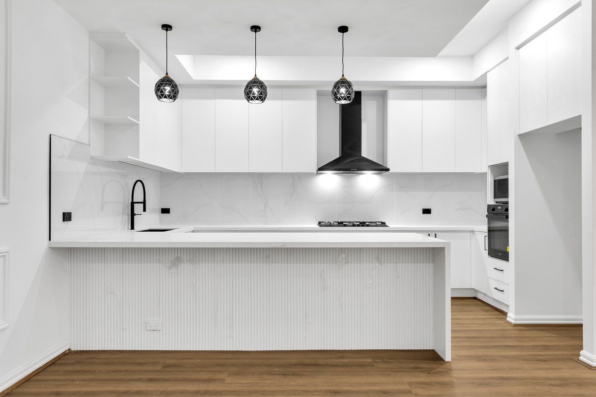Kitchen with island bench and pendant lights – 13 Tussock Way, Officer