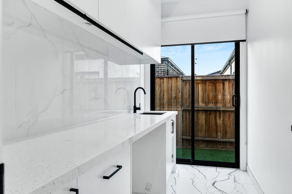 Kitchenette with stone benchtop – 13 Tussock Way, Officer